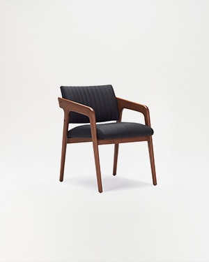 The Aux Armchair redefines comfort with its plush cushioning and sleek ashwood frame.AUX KOLTUK