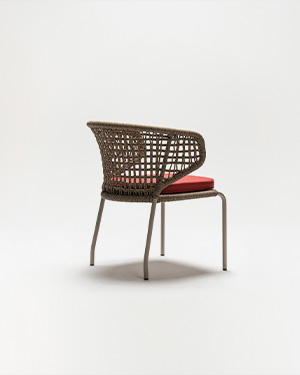 Metal and hand-made rope intertwine, crafting a chair that's both artistic and inviting.DUBAN KOLTUK