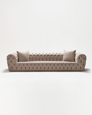 The Moon Sofa is a masterpiece of elegance, adorned with timeless capitoné detailing.AY KANEPE